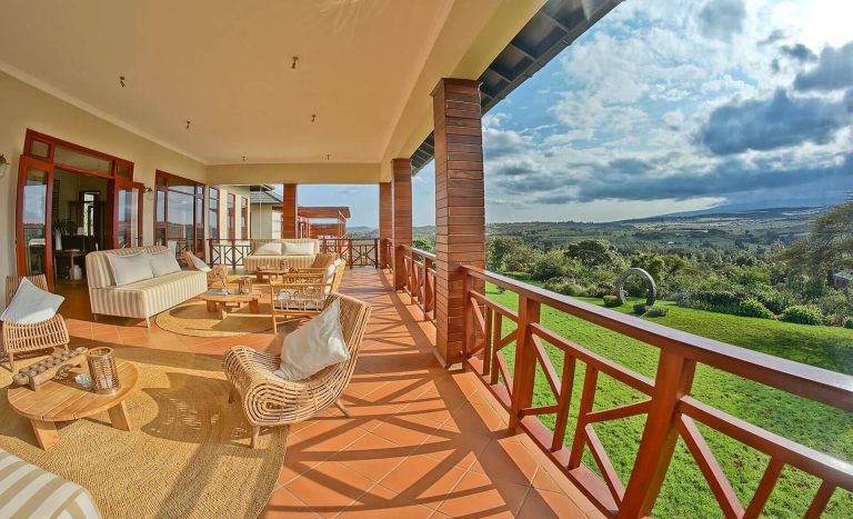 Lodge veranda overlooking green hills